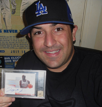 COTM7 Mike Centurioni holding a great Upper Deck Michael Jordan autograph card.