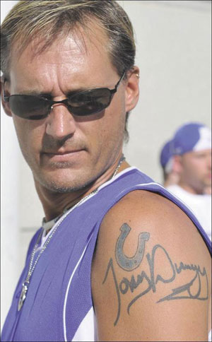 football players tattoos. team tattooed on his body.